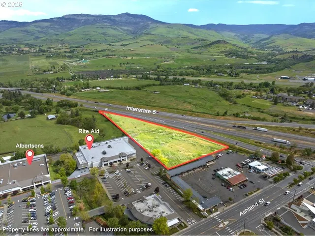 a view of a city with mountains in the background