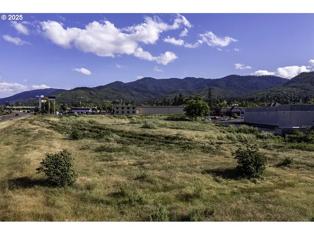 a view of lake with mountain and trees