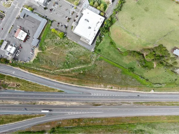 a view of a floor to ceiling window and a yard