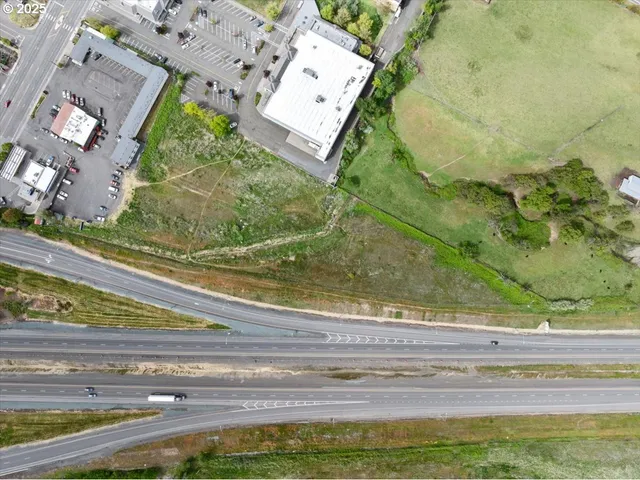 a view of a floor to ceiling window and a yard