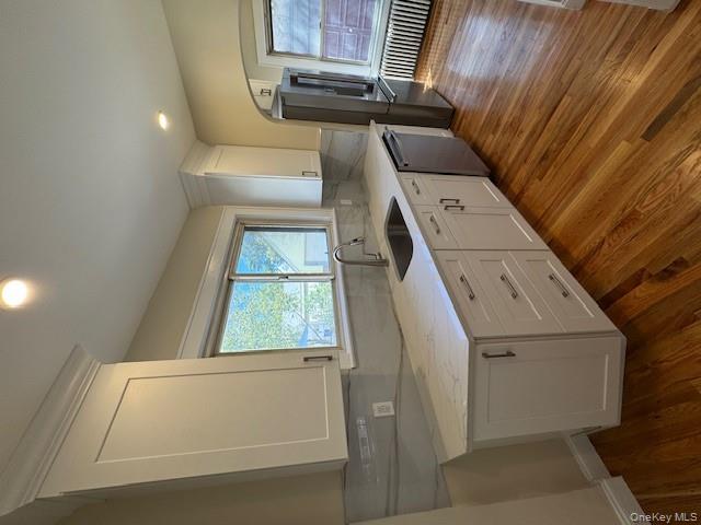 39 Ward Street, Unit 1 Floral Park, NY 11001 - Photo 3 of 11 a large kitchen with a sink and dish washer