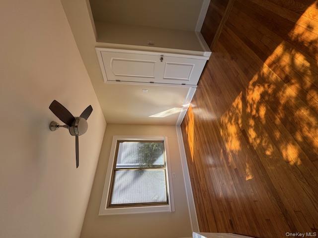 39 Ward Street, Unit 1 Floral Park, NY 11001 - Photo 8 of 11 a view of an empty room with wooden floor and a window
