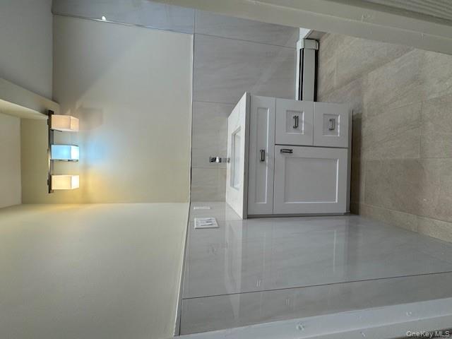 39 Ward Street, Unit 1 Floral Park, NY 11001 - Photo 9 of 11 a view of a kitchen with white cabinets