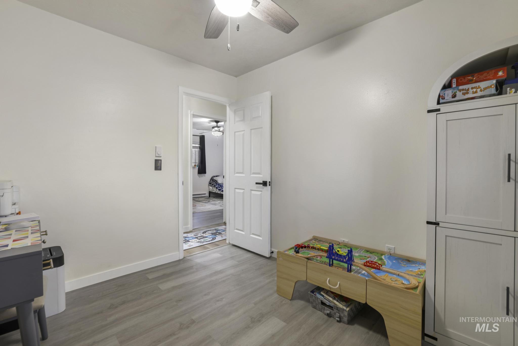 3083 Dickson Avenue Twin Falls, ID 83301 - Photo 19 of 26 Game room with light wood-style flooring and a ceiling fan