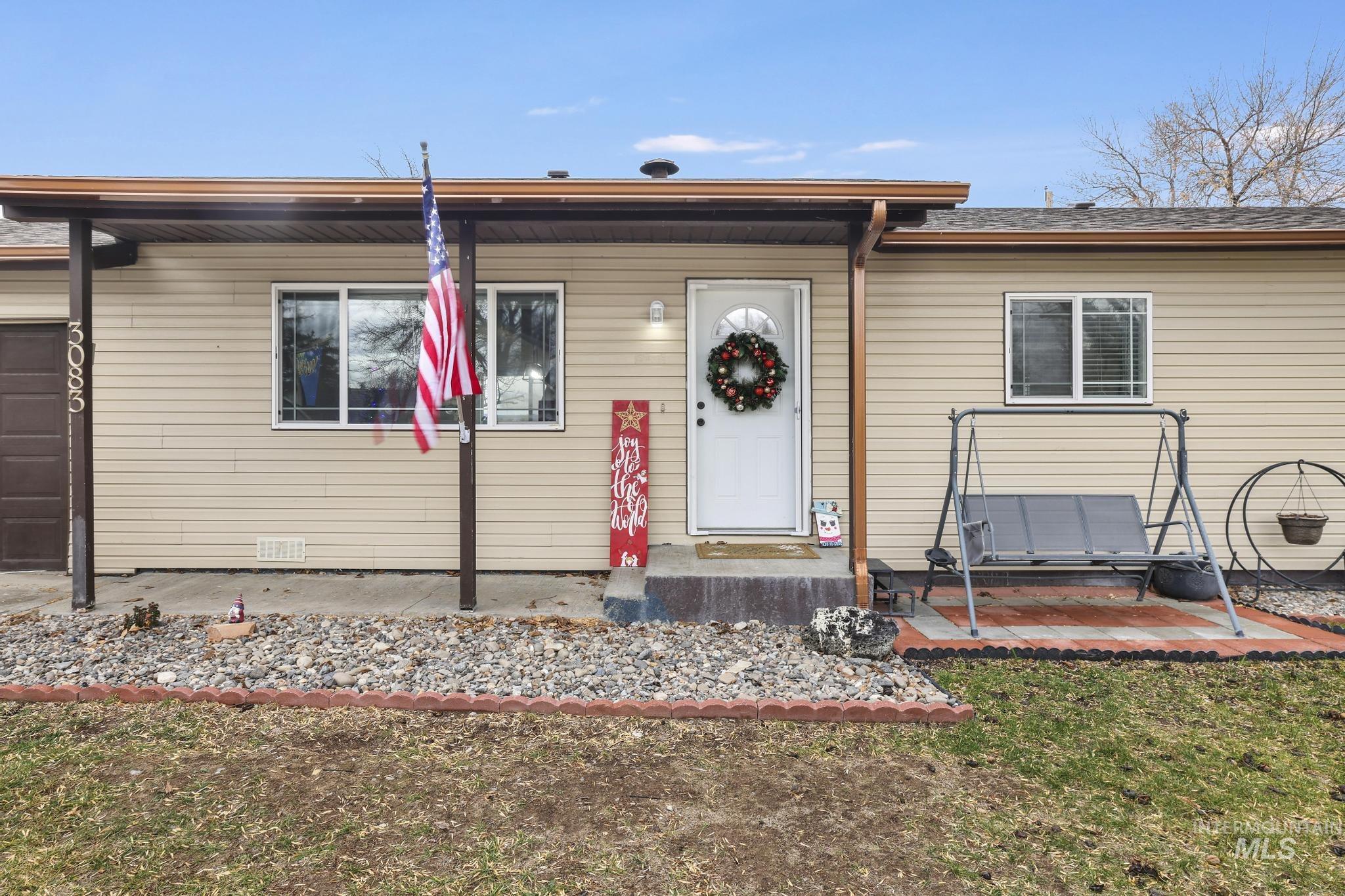 3083 Dickson Avenue Twin Falls, ID 83301 - Photo 25 of 26 View of front of home with a front yard and a garage