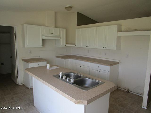 10200 Ahtanum Road Yakima, WA 98903 - Photo 28 of 38 a kitchen with a sink a stove and cabinets