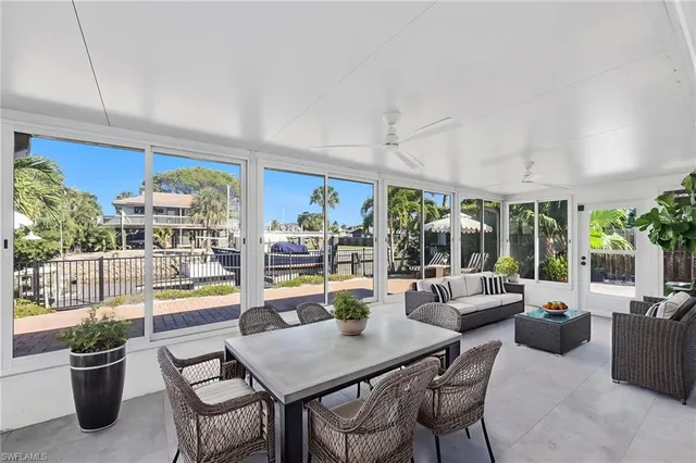 a view of a patio with a dining table and chairs