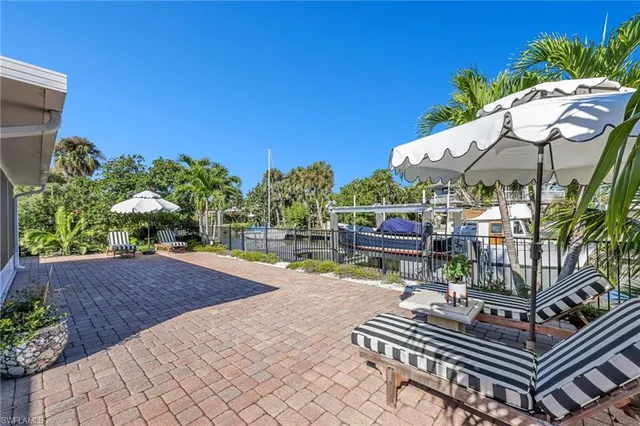 a view of a patio with a table and chairs