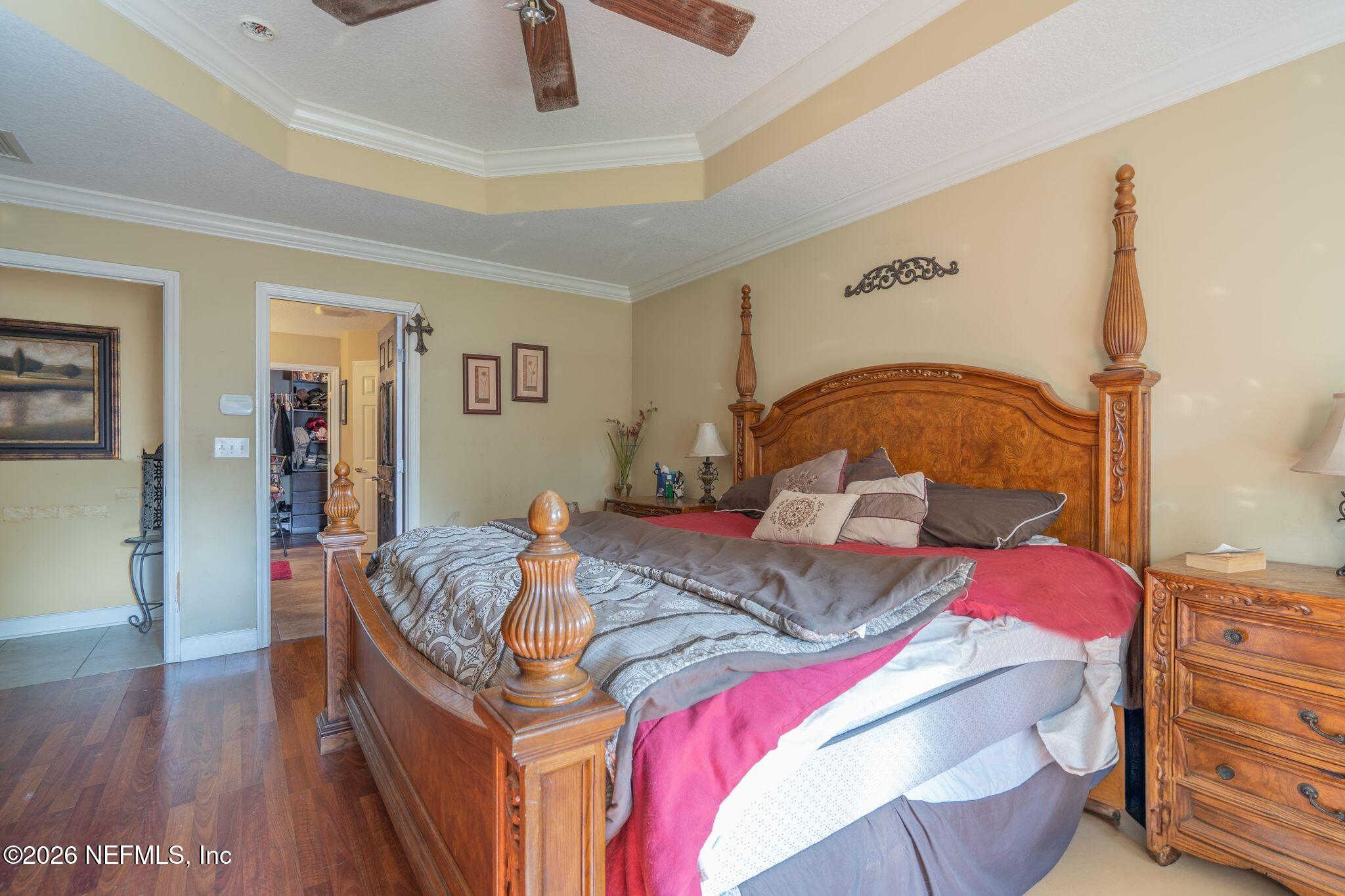 97447 Bluff View Circle Yulee, FL 32097 - Photo 14 of 19 a bedroom with a bed and wooden floor