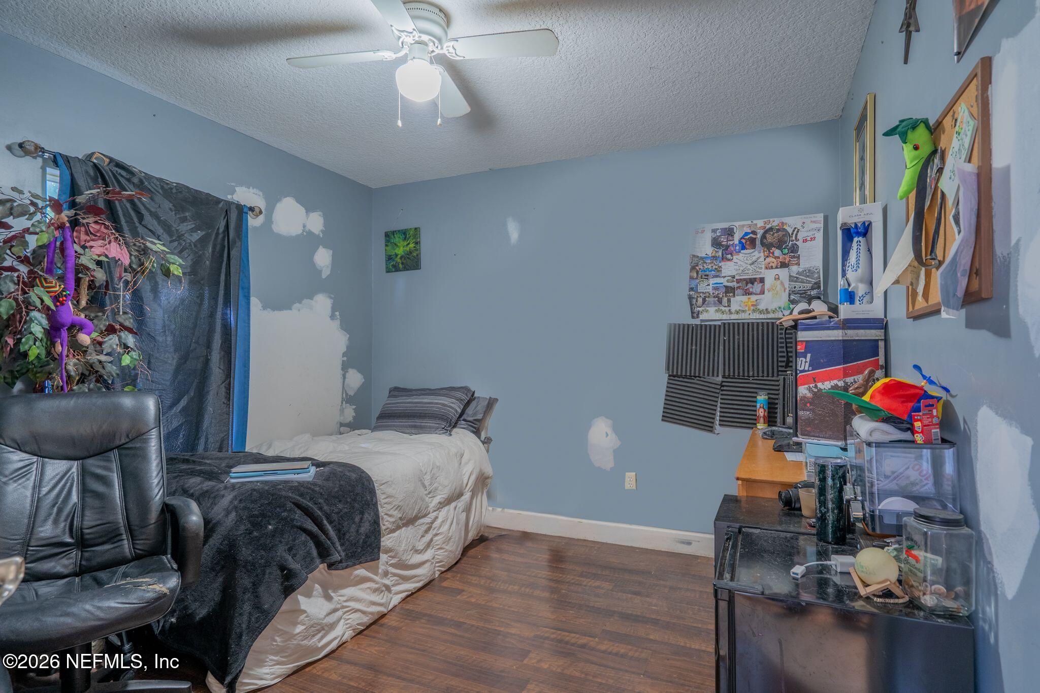 97447 Bluff View Circle Yulee, FL 32097 - Photo 16 of 19 a bedroom with furniture and a window