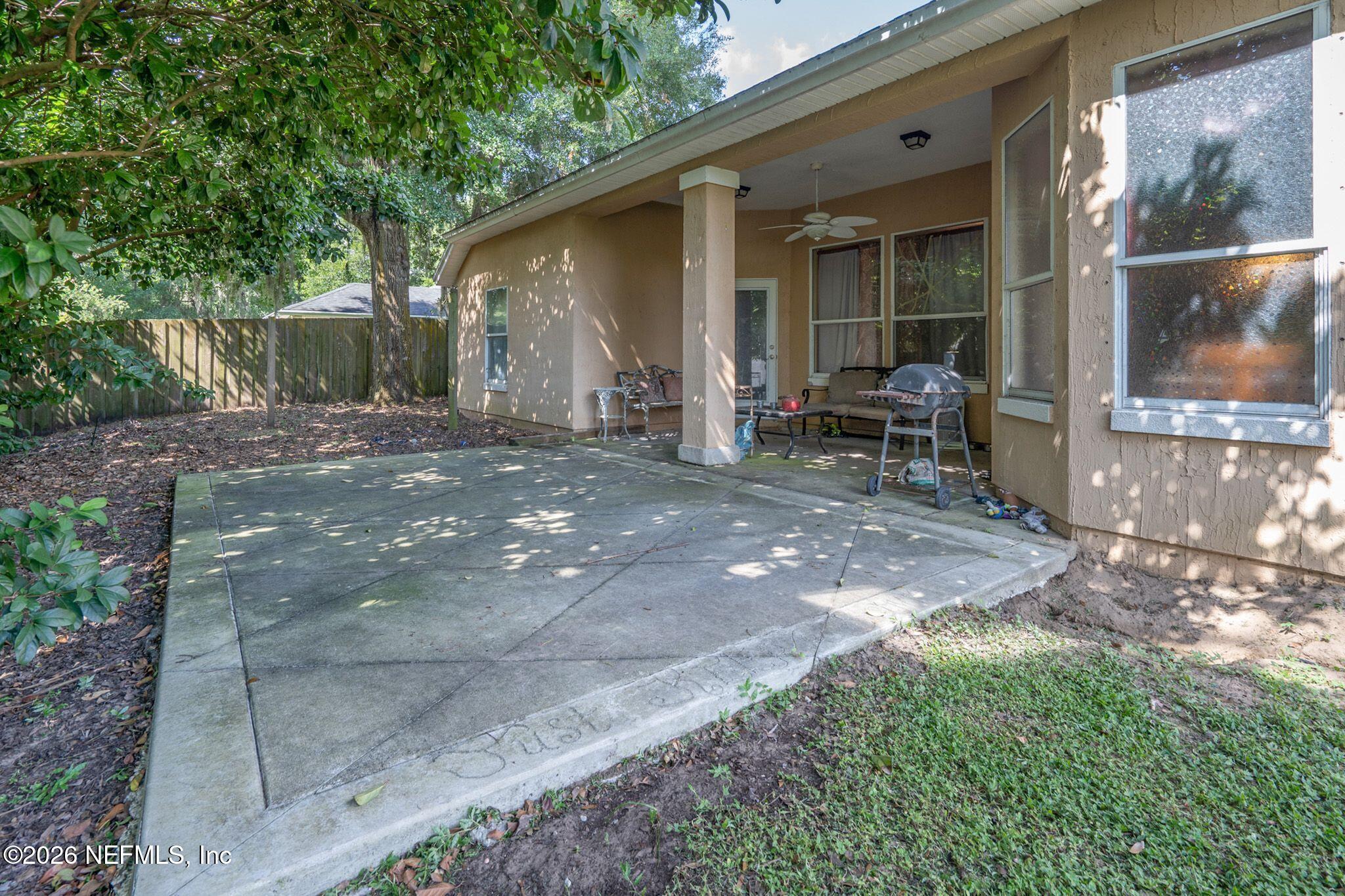 97447 Bluff View Circle Yulee, FL 32097 - Photo 18 of 19 a view of a outdoor space with a patio and backyard