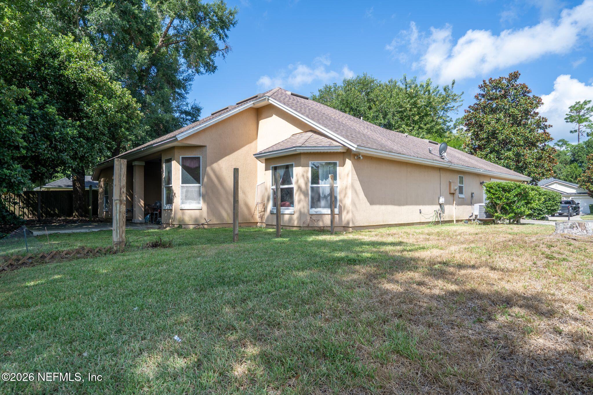 97447 Bluff View Circle Yulee, FL 32097 - Photo 19 of 19 a front view of house with yard and green space