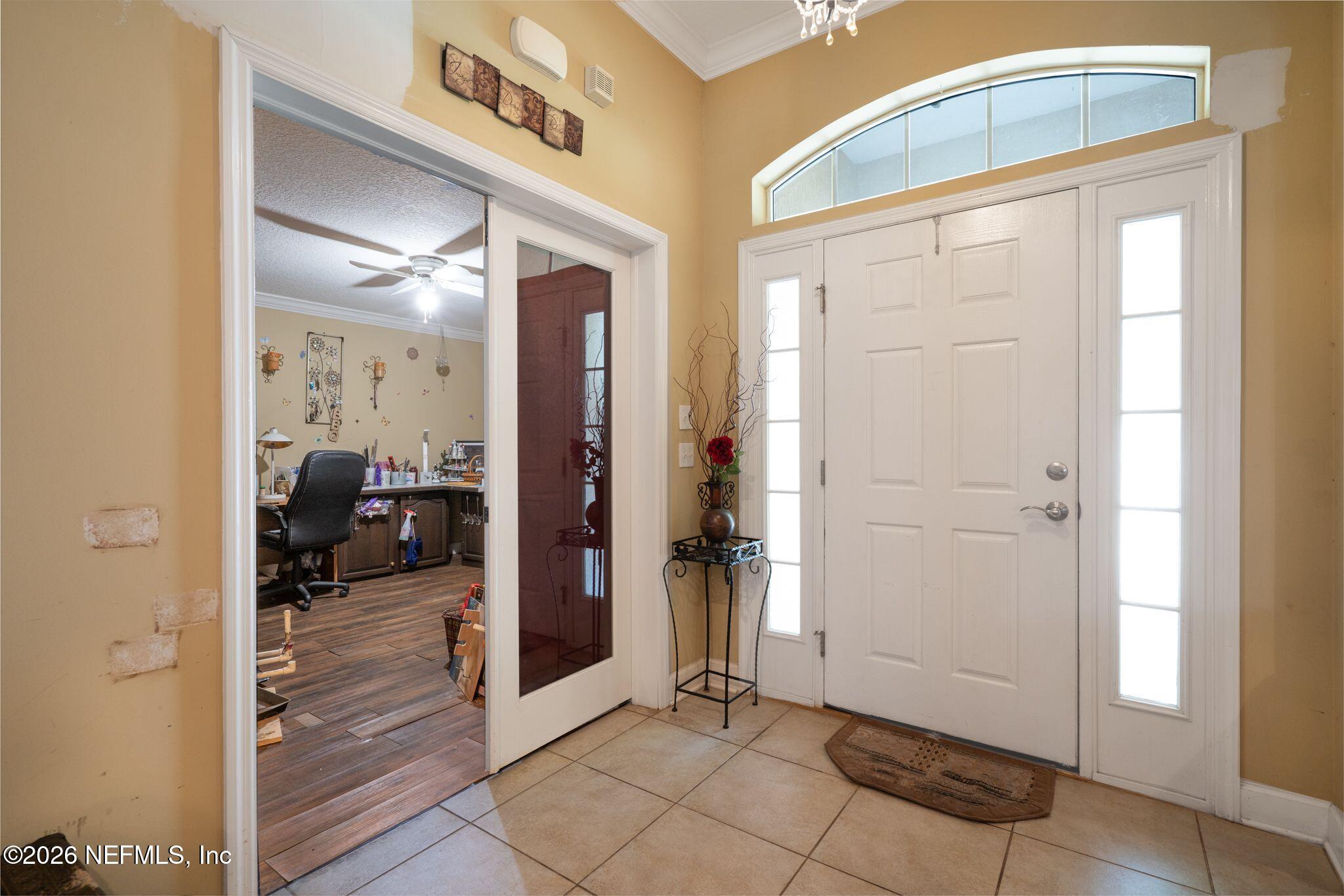 97447 Bluff View Circle Yulee, FL 32097 - Photo 4 of 19 a view of a hallway with closet and a mirror