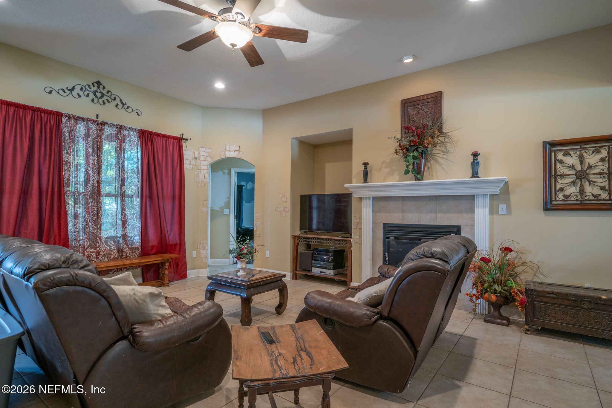 97447 Bluff View Circle Yulee, FL 32097 - Photo 5 of 19 a living room with furniture and a fireplace