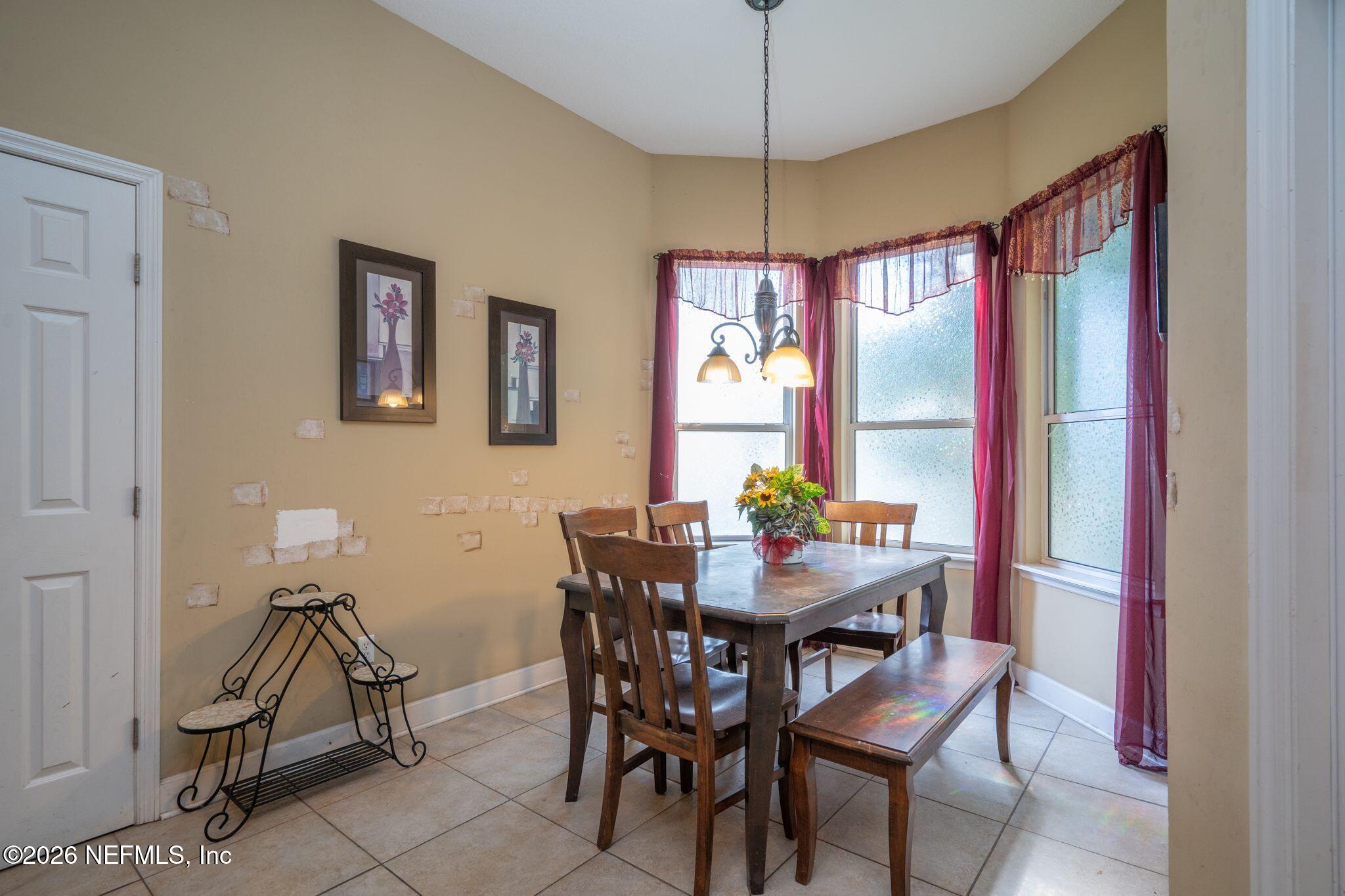 97447 Bluff View Circle Yulee, FL 32097 - Photo 10 of 19 a view of a dining room with furniture window and outside view