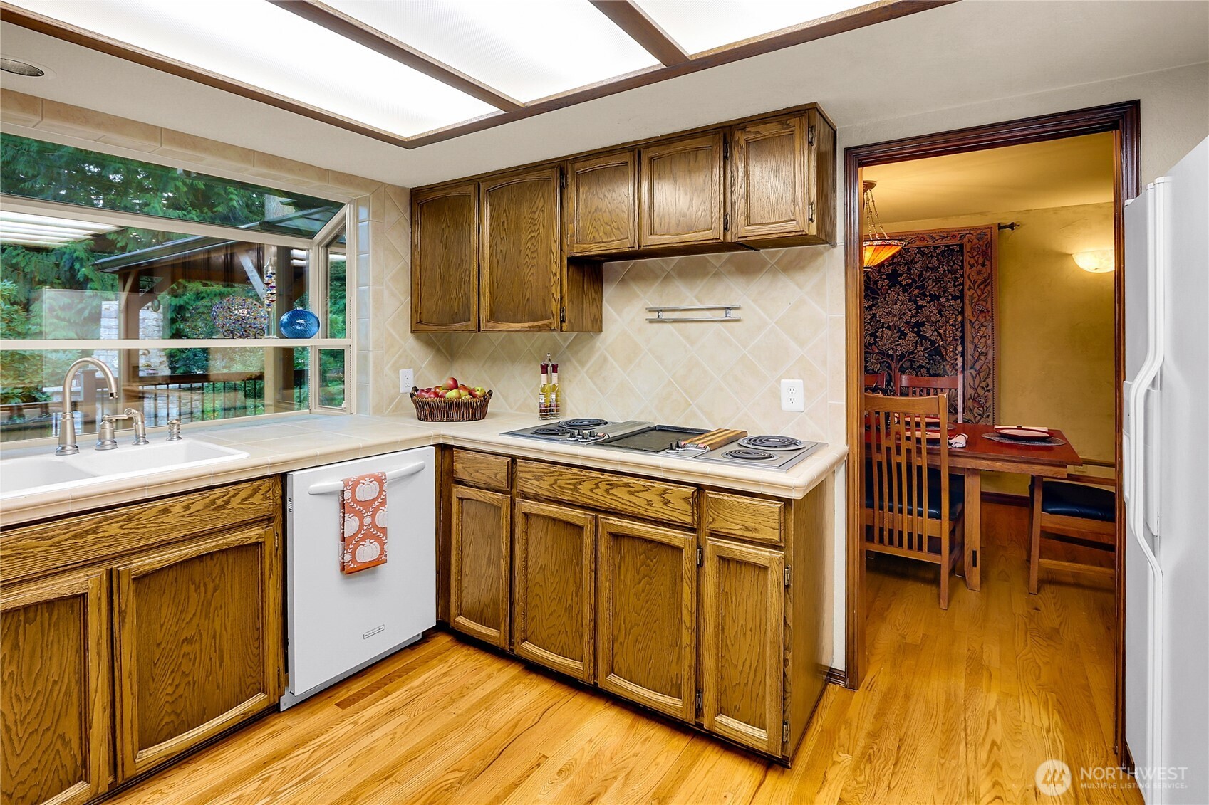 17521 7th Avenue West Bothell, WA 98012 - Photo 12 of 40 a kitchen with stainless steel appliances granite countertop a stove a sink and a refrigerator
