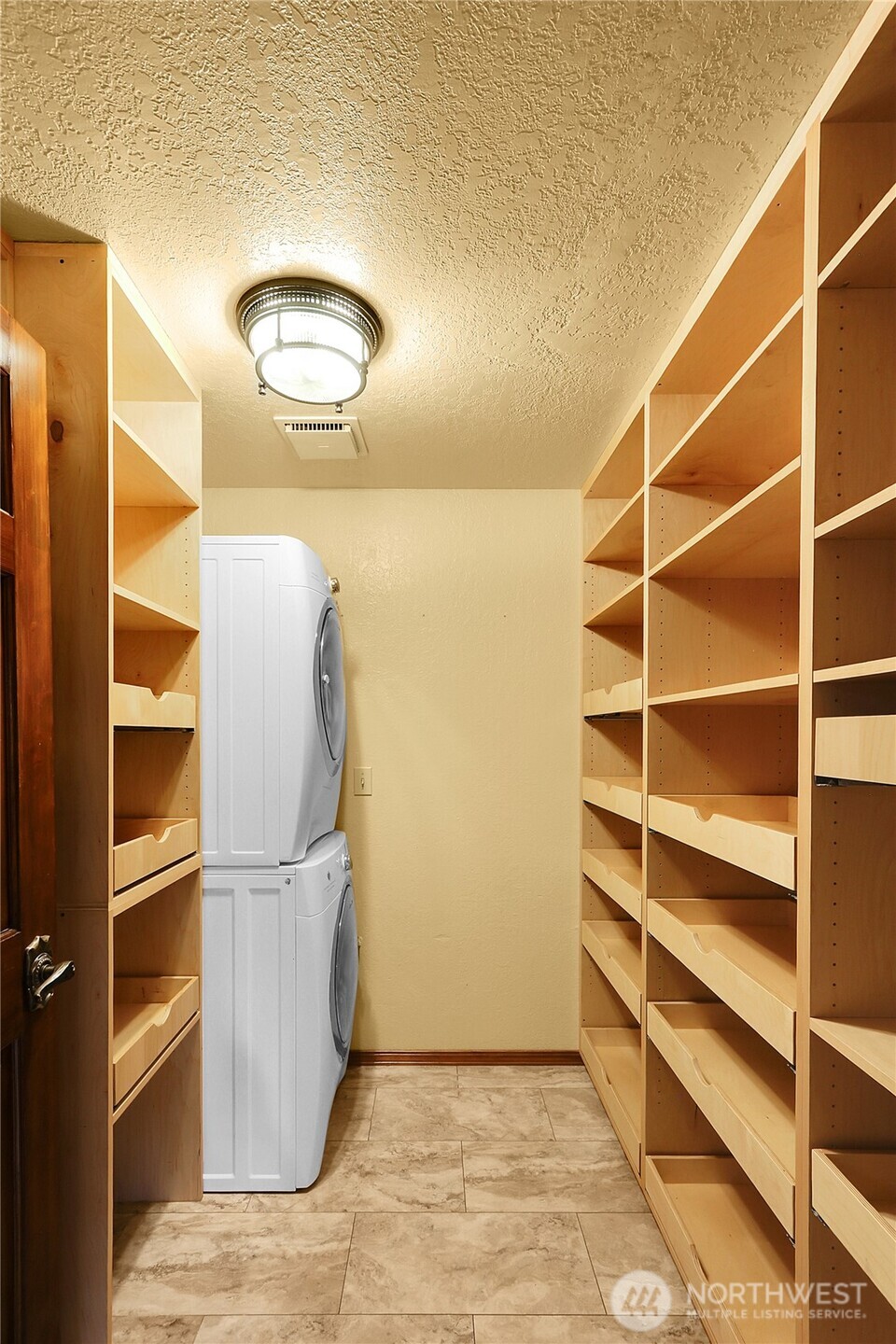 17521 7th Avenue West Bothell, WA 98012 - Photo 13 of 40 a view of a room with wooden floor and door