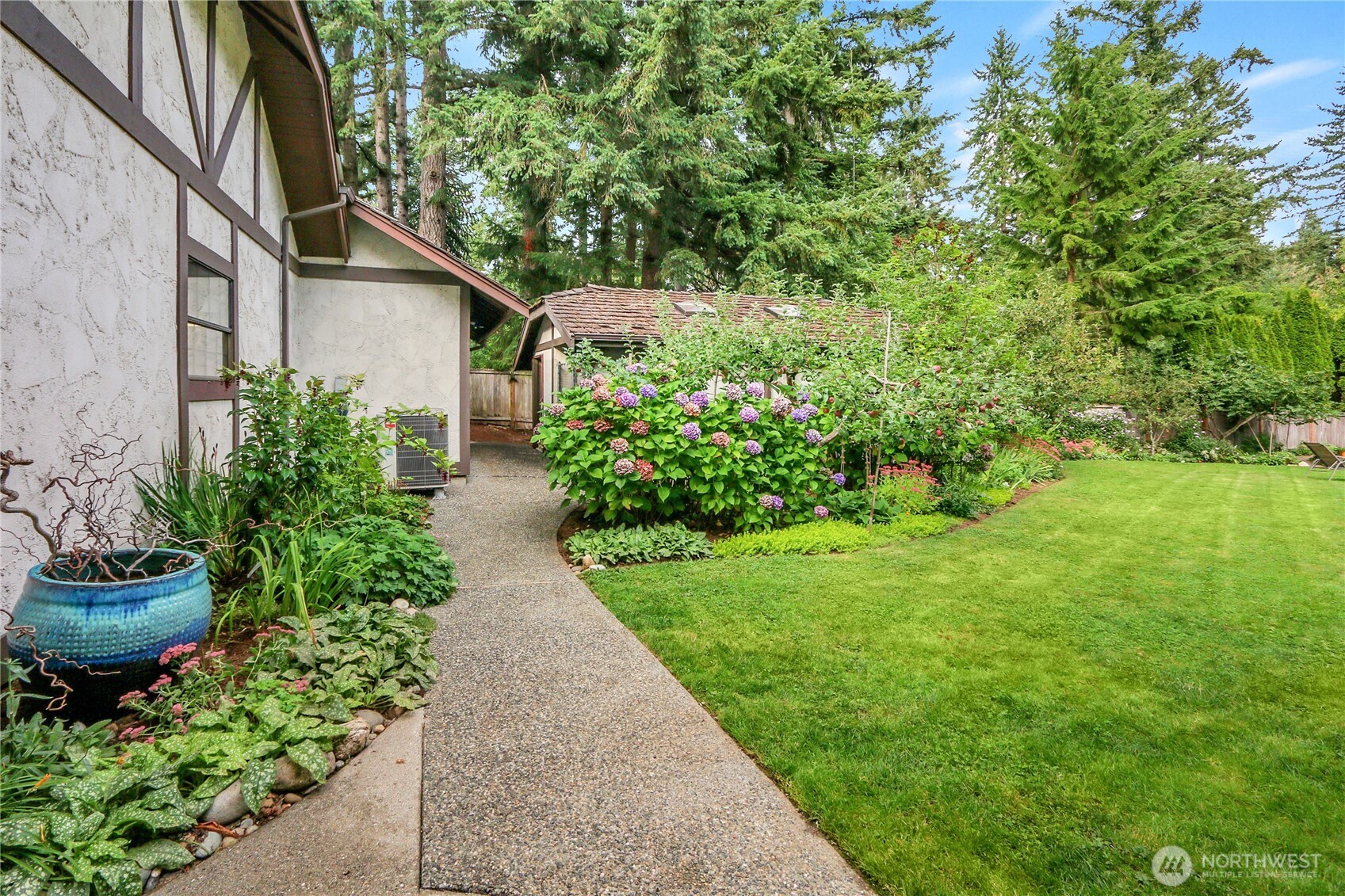 17521 7th Avenue West Bothell, WA 98012 - Photo 29 of 40 a view of a back yard with potted plants