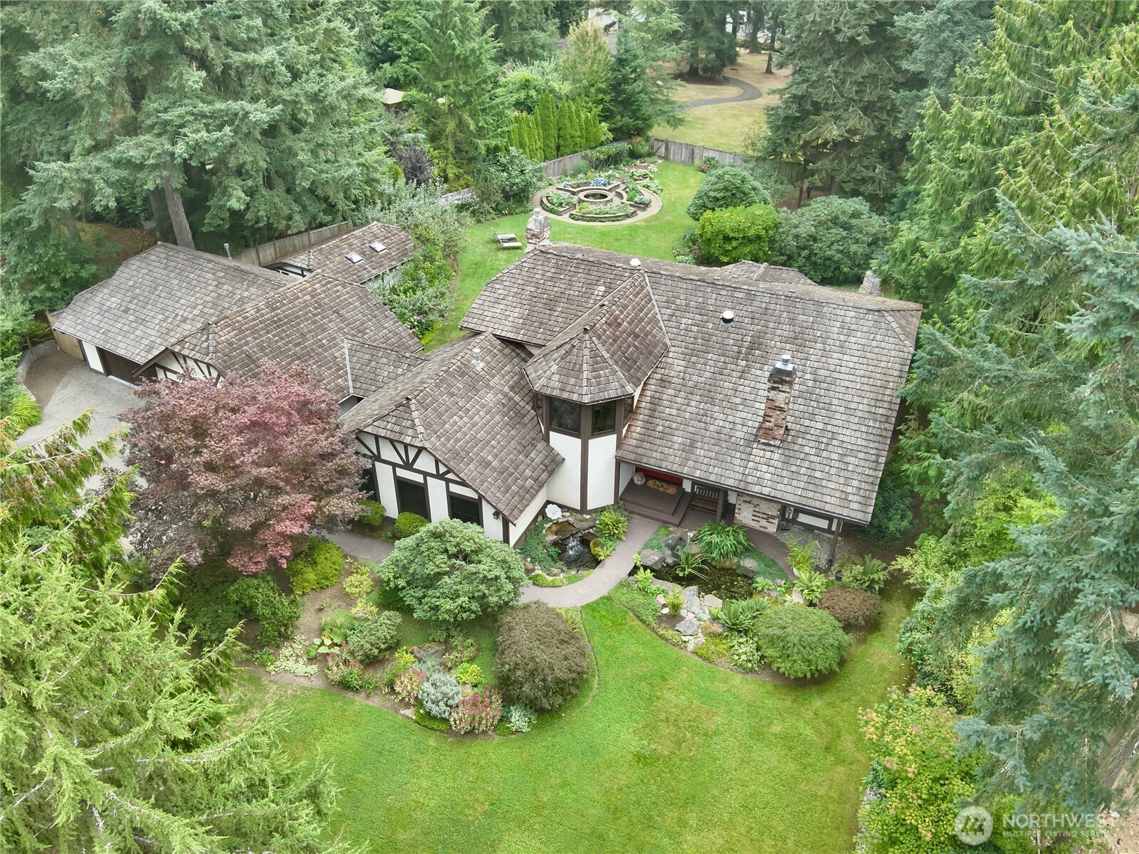 17521 7th Avenue West Bothell, WA 98012 - Photo 3 of 40 an aerial view of residential house with outdoor space and trees all around