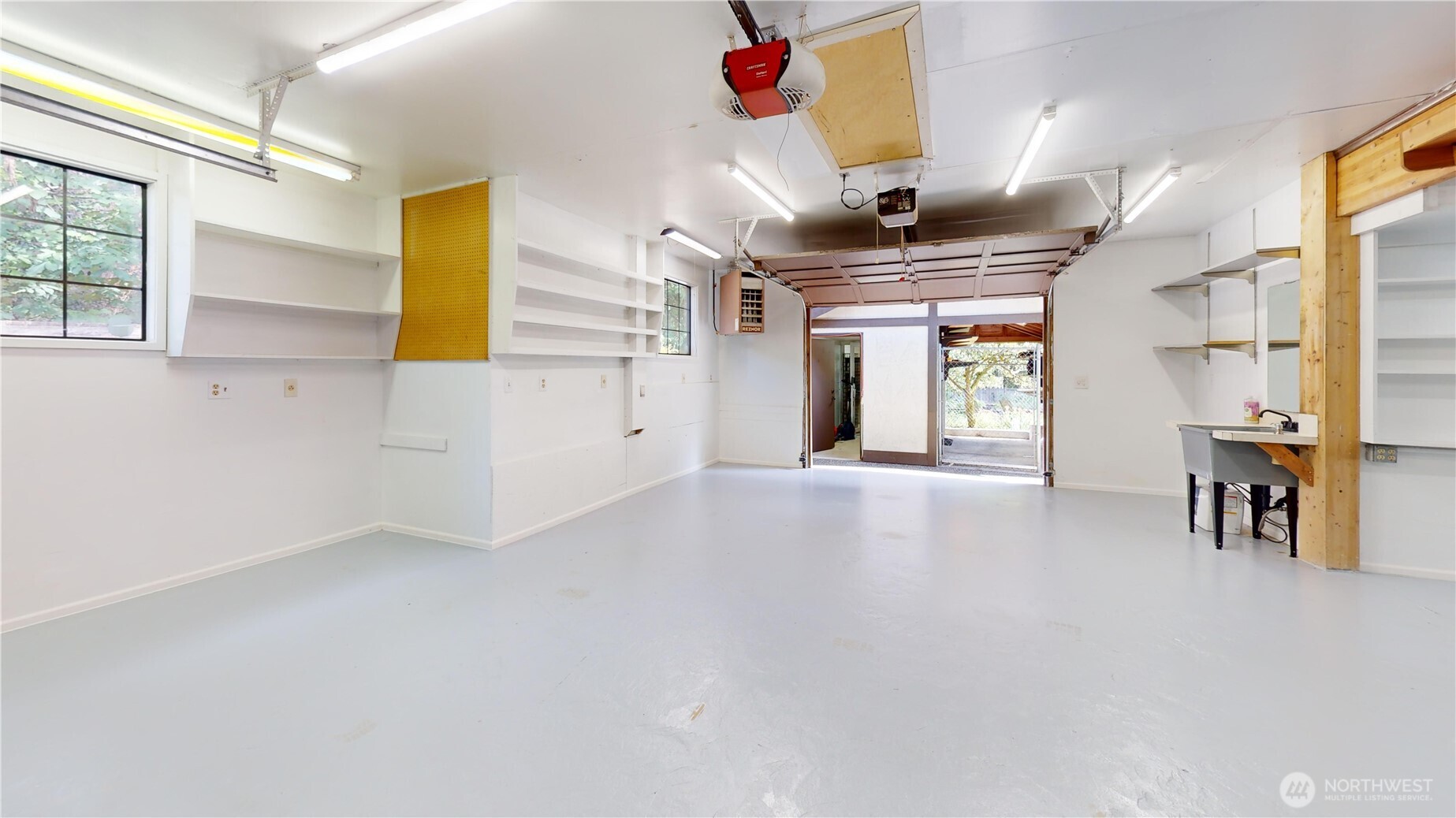 17521 7th Avenue West Bothell, WA 98012 - Photo 32 of 40 a view of an empty room with window and kitchen view