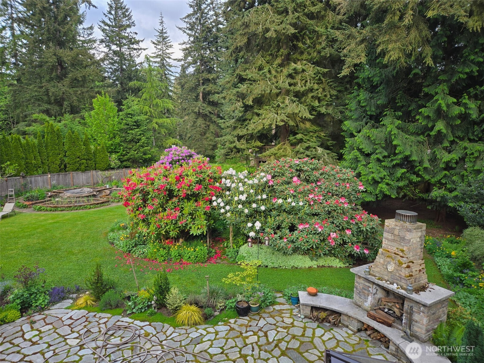 17521 7th Avenue West Bothell, WA 98012 - Photo 35 of 40 a front view of a house with a yard and fountain