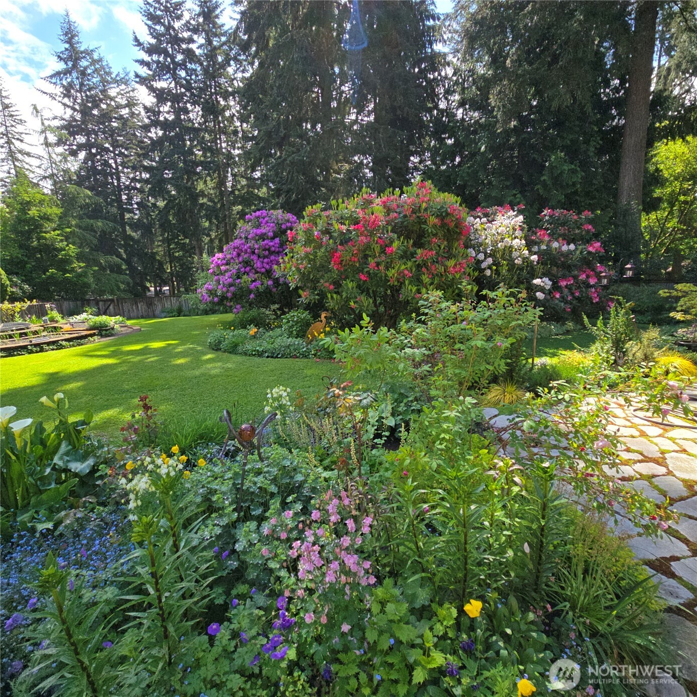 17521 7th Avenue West Bothell, WA 98012 - Photo 39 of 40 a front view of a house with a yard and fountain