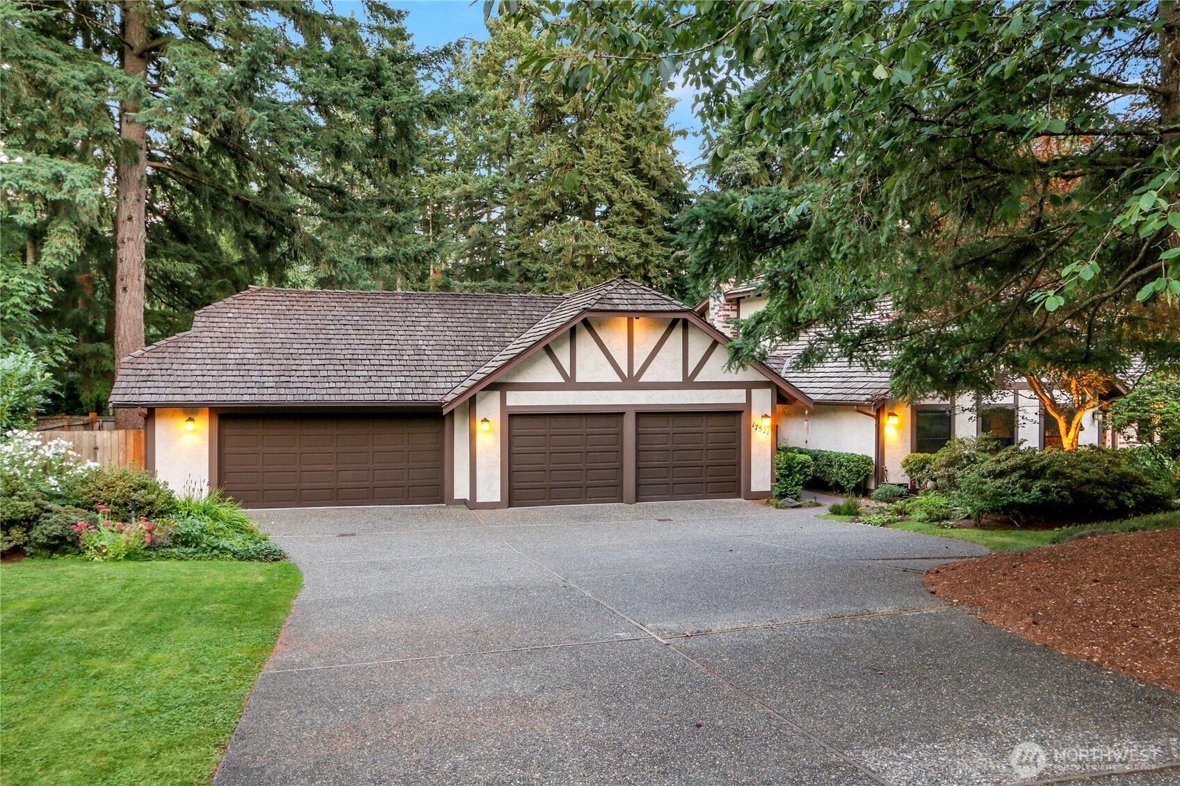 17521 7th Avenue West Bothell, WA 98012 - Photo 5 of 40 a front view of a house with a garden and trees