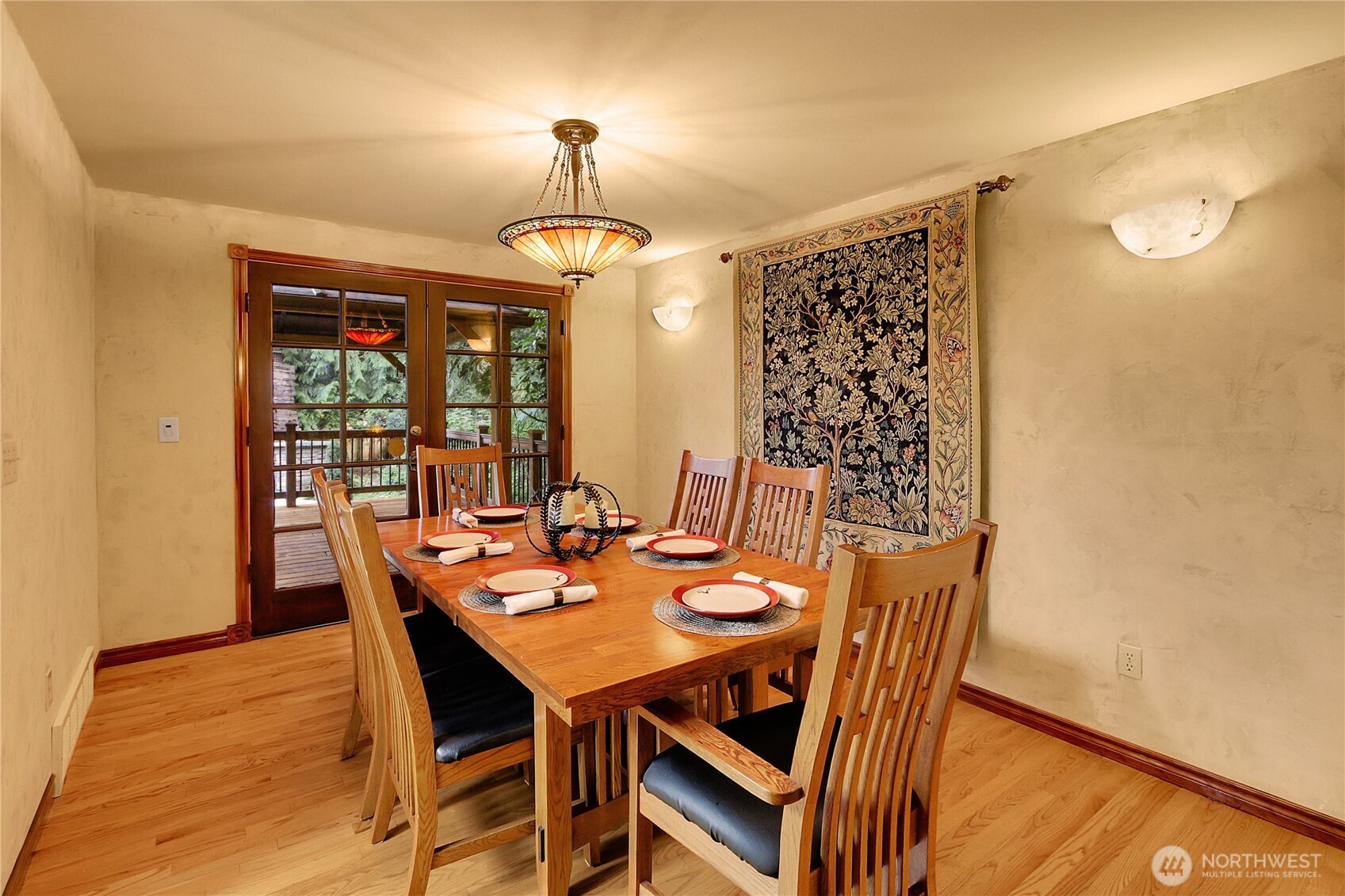 17521 7th Avenue West Bothell, WA 98012 - Photo 10 of 40 a view of a dining room with furniture wooden floor and chandelier