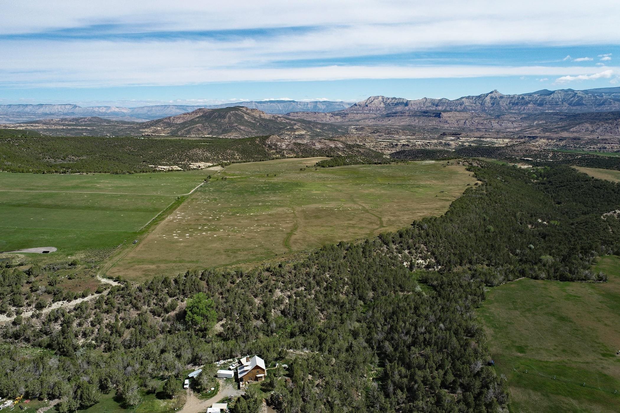 47262 KE Road Mesa, CO 81643 - Photo 4 of 7 a view of a lake with a mountain
