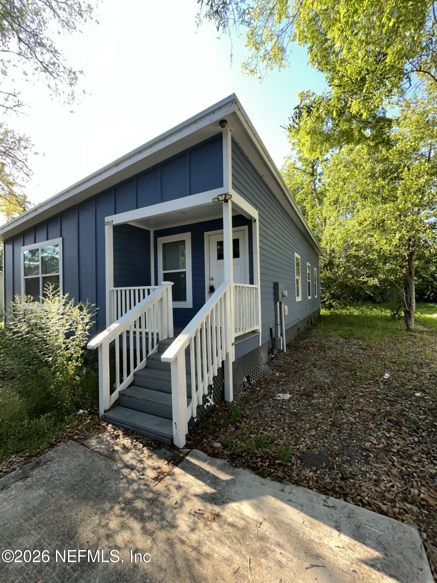 2017 Talladega Road Jacksonville, FL 32209 - Photo 2 of 34 a view of a house with backyard and porch