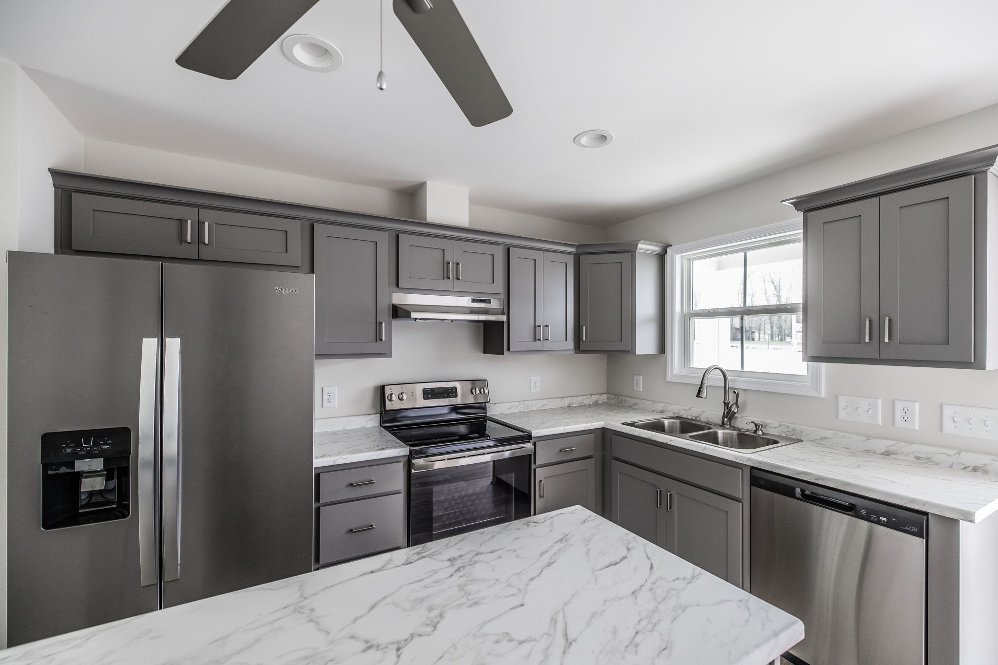100 Billy Robb Street, Unit B Greenbrier, TN 37073 - Photo 11 of 35 a kitchen with stainless steel appliances granite countertop a refrigerator stove top oven and sink