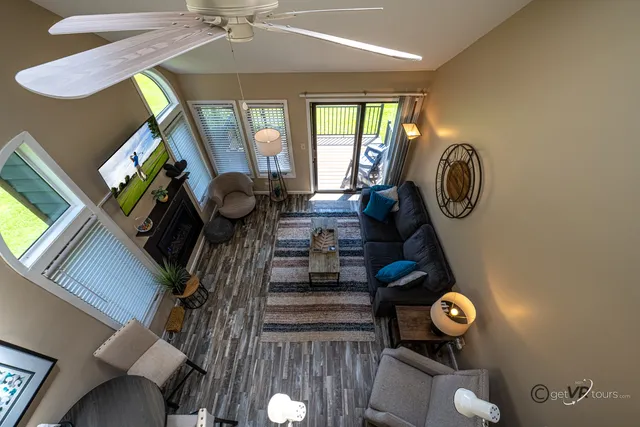 a view of living room with furniture and a window