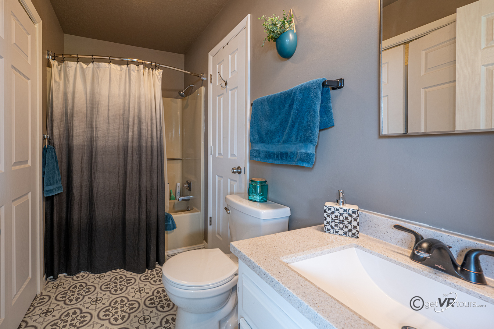 20 Spring Creek Lane Galena, IL 61036 - Photo 5 of 23 a bathroom with a sink a toilet and shower curtain