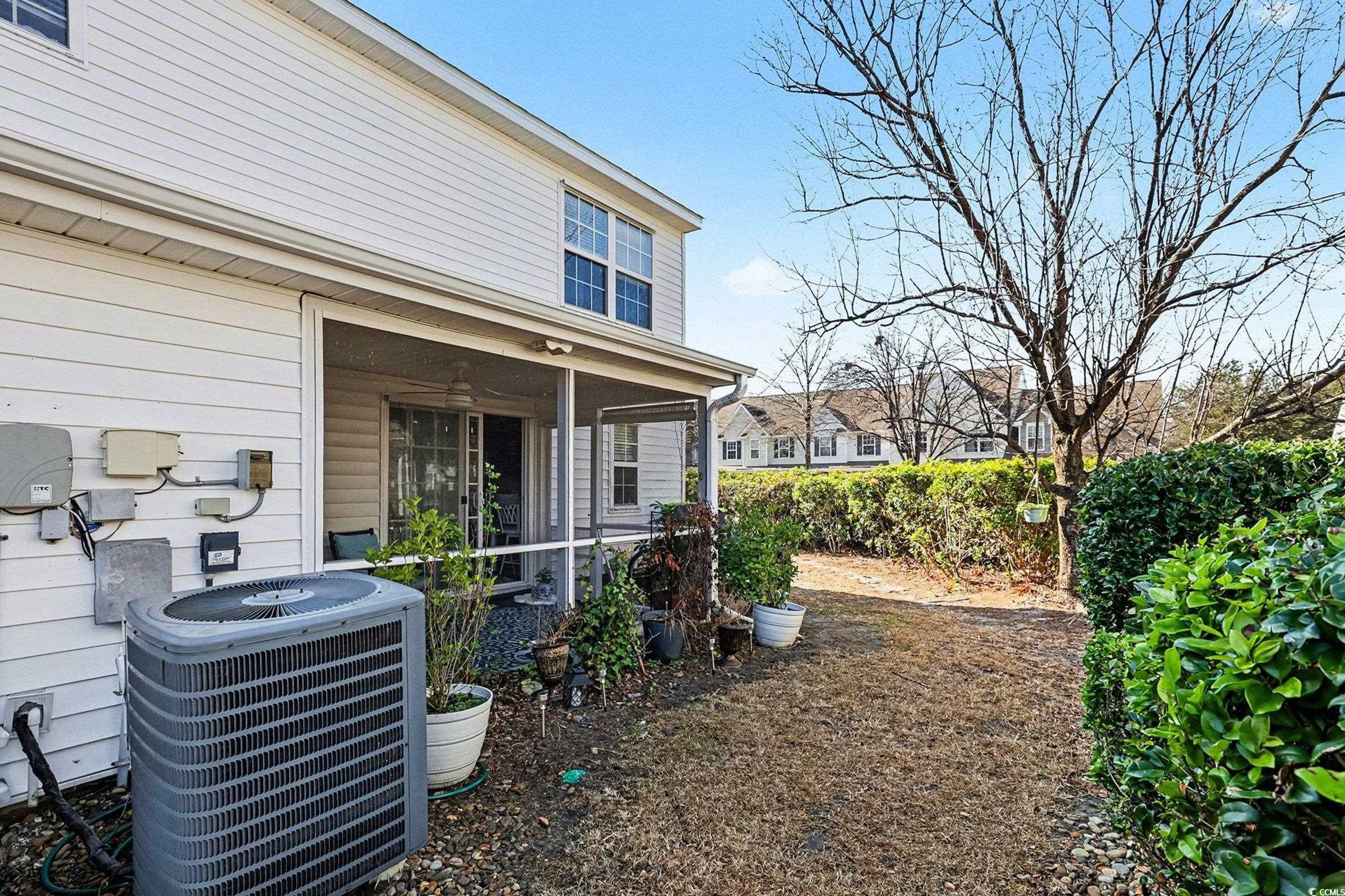 844 Sheridan Road, Unit 844 Myrtle Beach, SC 29579 - Photo 20 of 24 View of yard with a sunroom