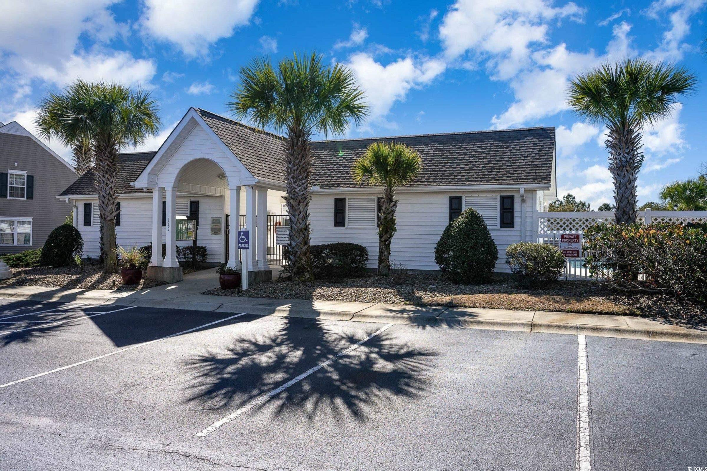844 Sheridan Road, Unit 844 Myrtle Beach, SC 29579 - Photo 23 of 24 View of front of home featuring uncovered parking and roof with shingles