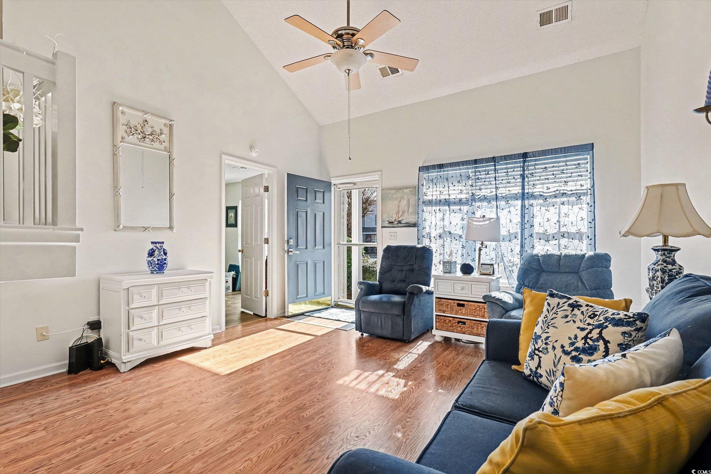 844 Sheridan Road, Unit 844 Myrtle Beach, SC 29579 - Photo 6 of 24 Living room with high vaulted ceiling, wood finished floors, plenty of natural light, and ceiling fan
