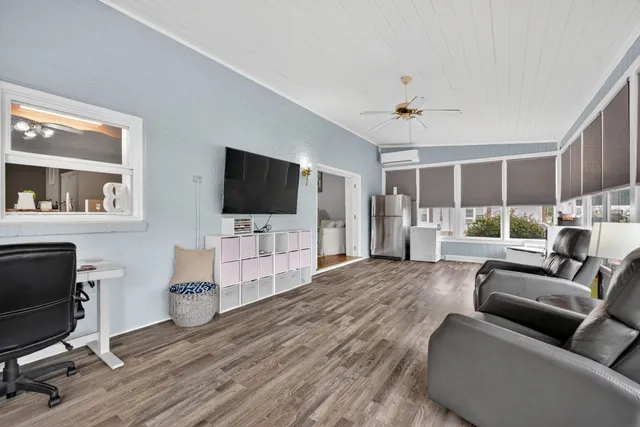 a kitchen with stainless steel appliances granite countertop a stove a sink dishwasher a refrigerator with a dining table and chairs