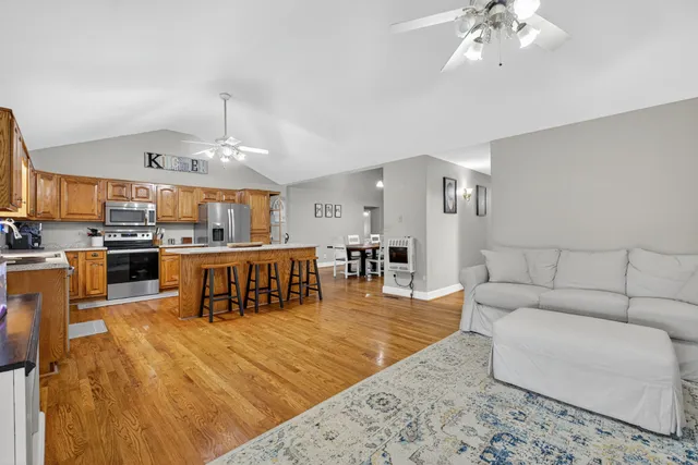 a bathroom with a double vanity sink toilet and a mirror