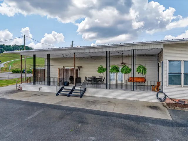 an aerial view of a house with outdoor space swimming pool