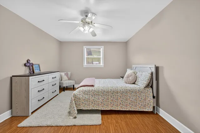 a living room with furniture a flat screen tv and kitchen view