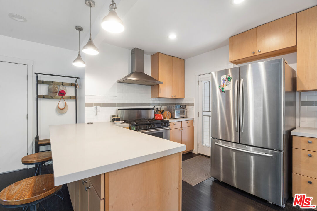 430 Rialto Avenue Venice, CA 90291 - Photo 12 of 23 a kitchen with stainless steel appliances a refrigerator and a stove top oven