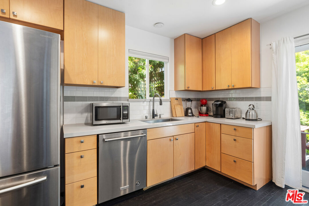 430 Rialto Avenue Venice, CA 90291 - Photo 13 of 23 a kitchen with white cabinets and a refrigerator