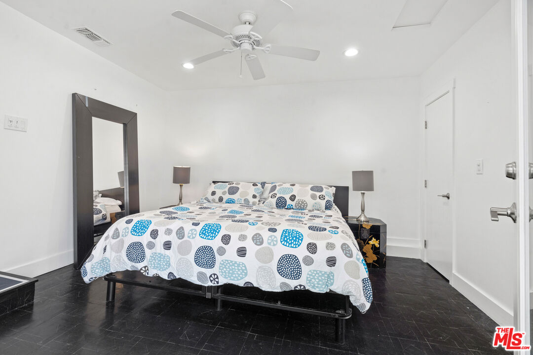 430 Rialto Avenue Venice, CA 90291 - Photo 15 of 23 a bedroom with a bed and wooden floor