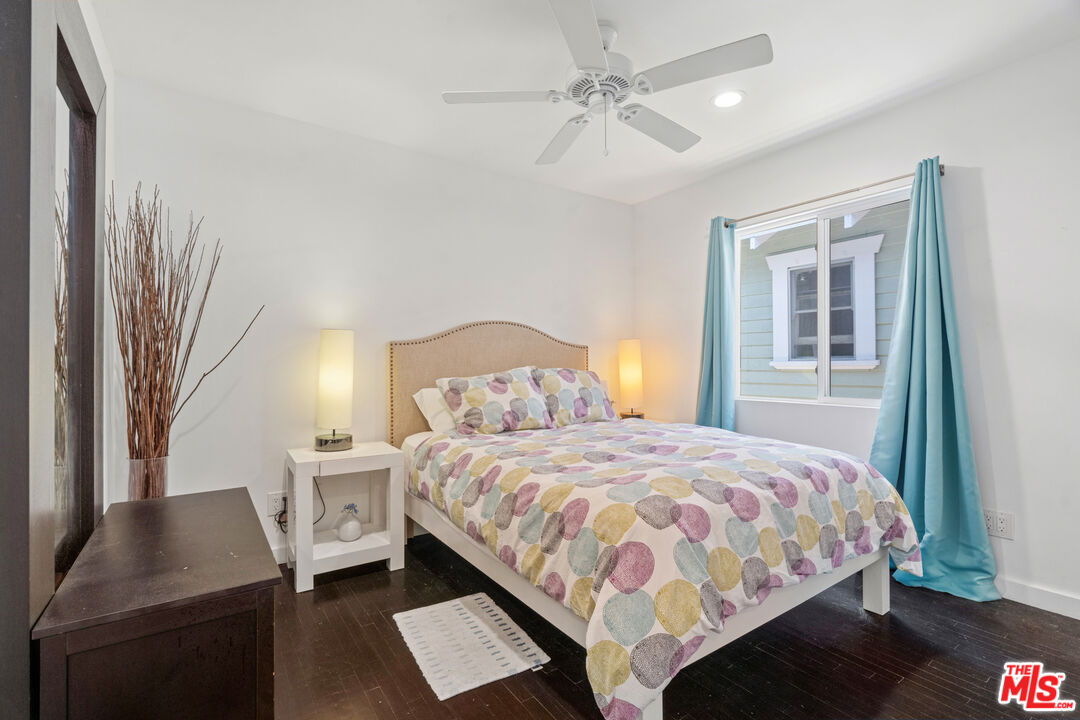 430 Rialto Avenue Venice, CA 90291 - Photo 17 of 23 a bedroom with a bed a couch and a window