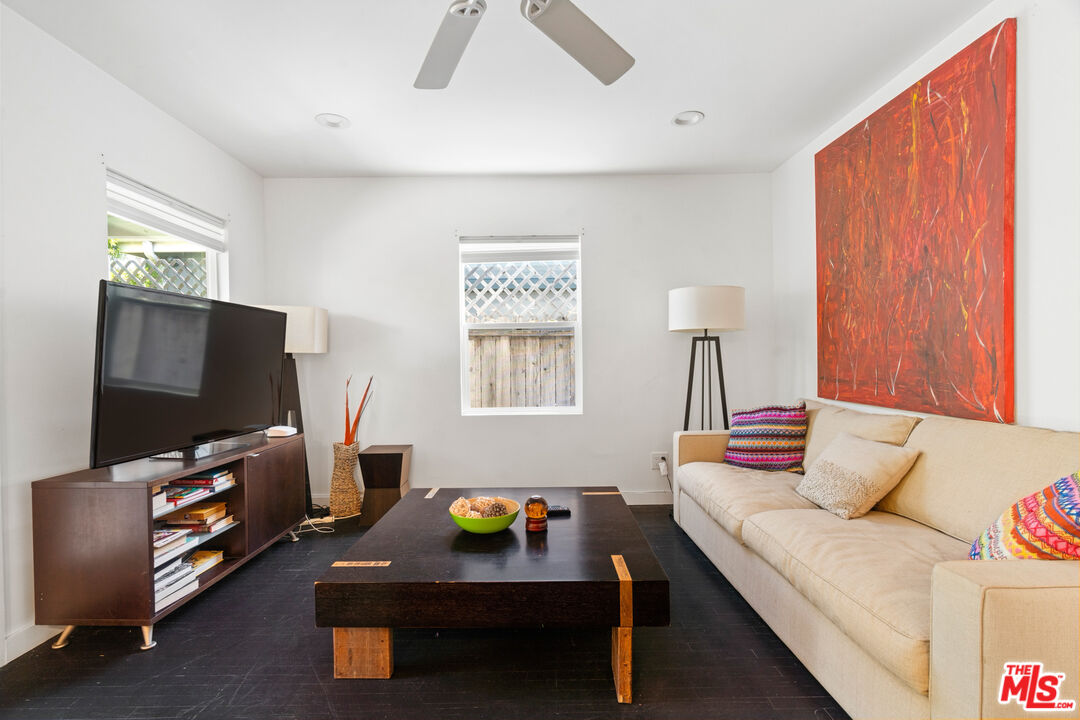 430 Rialto Avenue Venice, CA 90291 - Photo 7 of 23 a living room with furniture and a flat screen tv