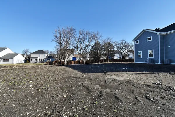 a view of large house with a yard