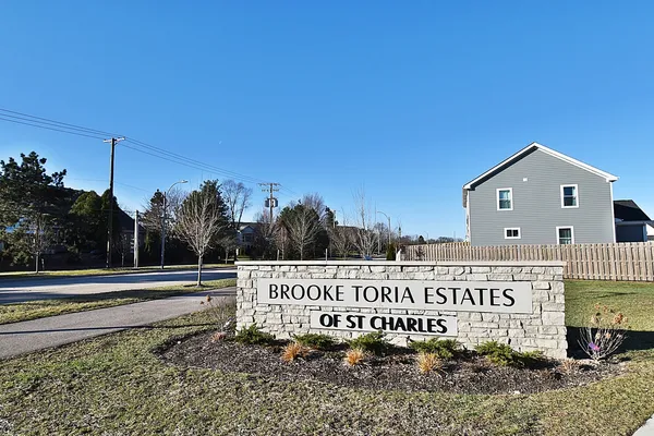 a view of a street with a building in the background