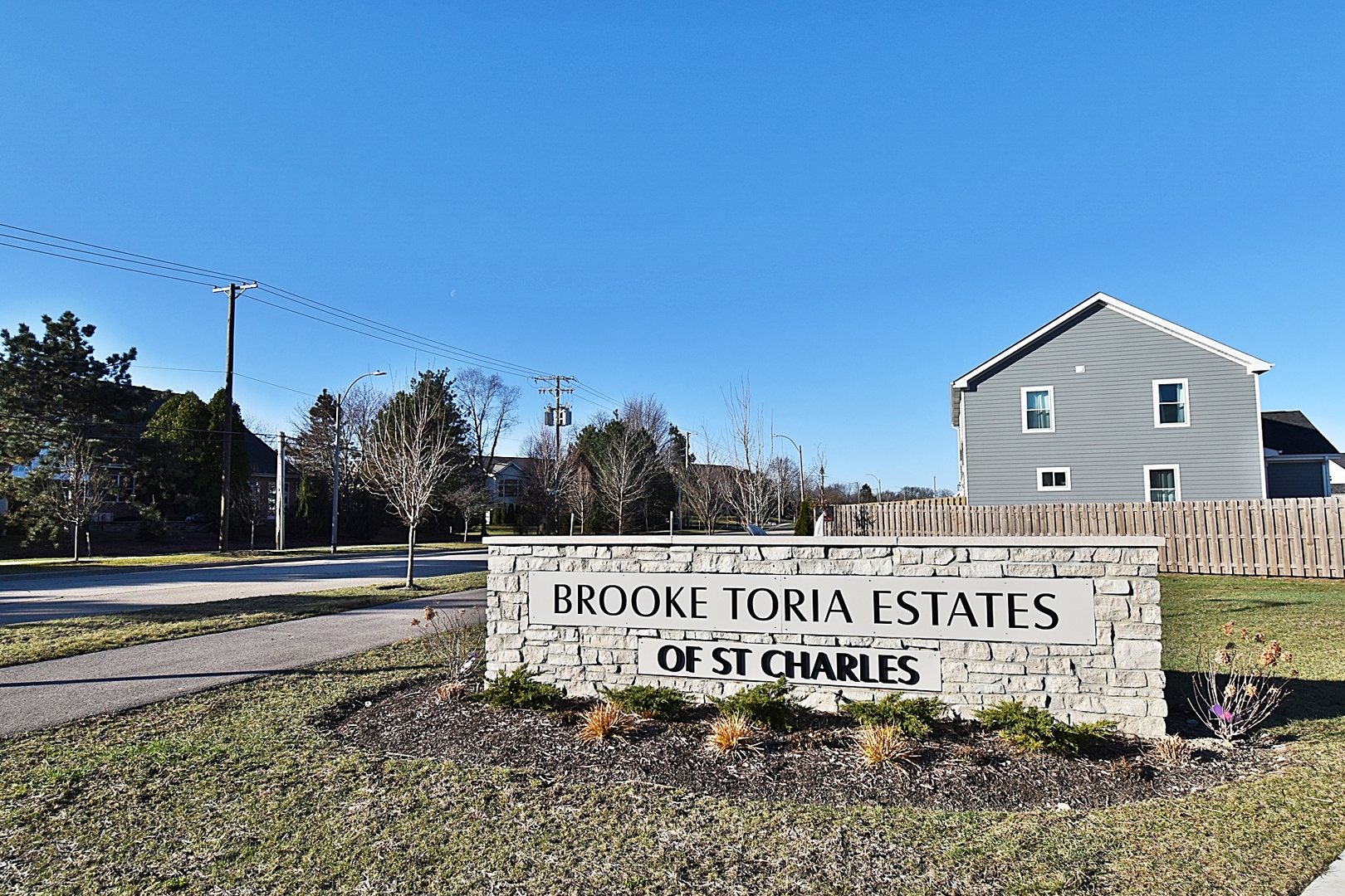 4012 Faith Lane St. Charles, IL 60174 - Photo 2 of 24 a view of a street with a building in the background