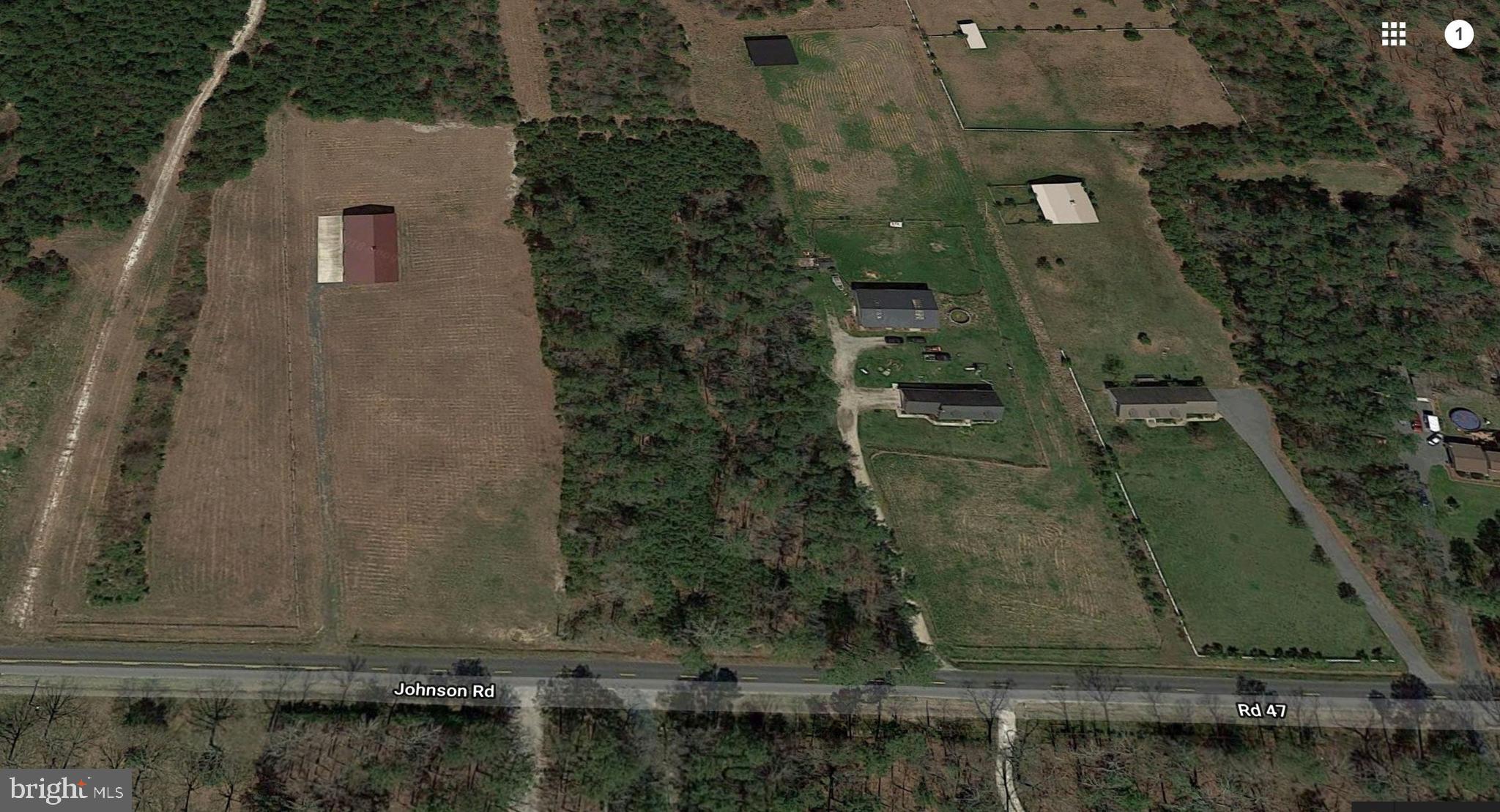 8.01 Johnson Road Georgetown, DE 19947 - Photo 1 of 3 Wooded parcel in center of aerial is subject