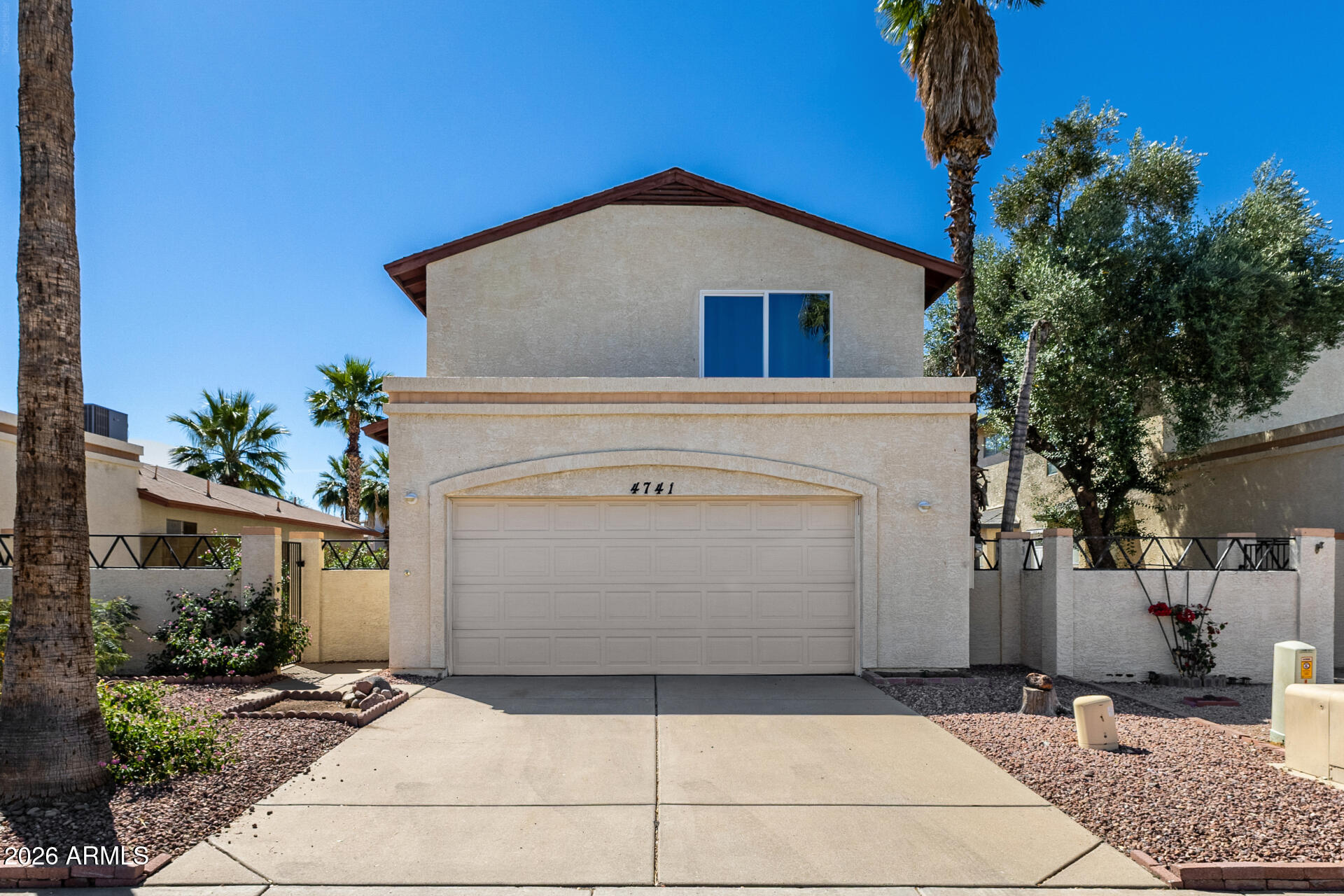 a front view of a house with a garage